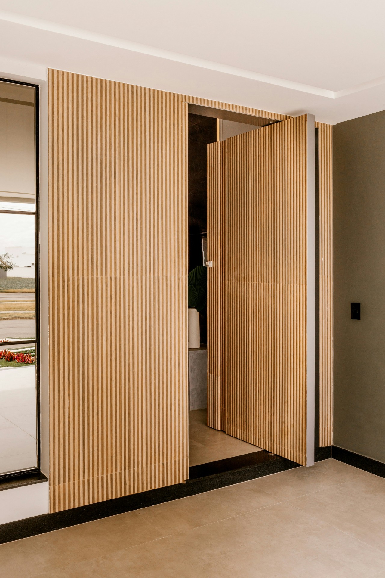 Vertical slatted timber entry door